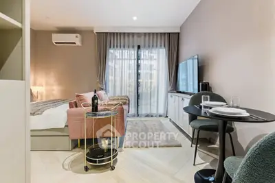 Stylish modern living room with cozy seating and elegant decor in a contemporary apartment.