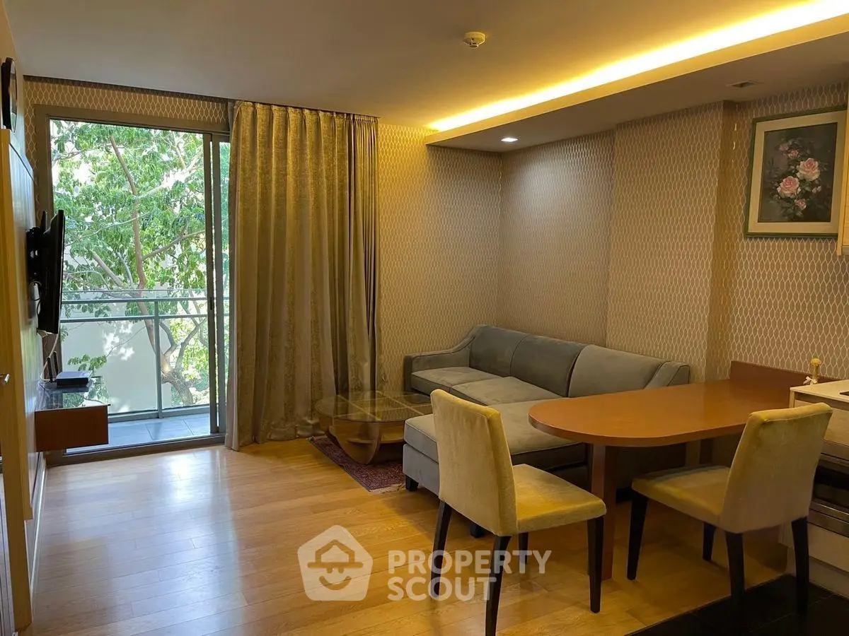 Cozy living room with elegant decor and balcony view