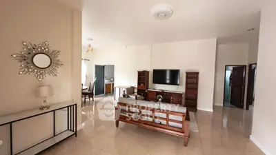 Spacious living room with elegant decor and modern furniture in a stylish home.