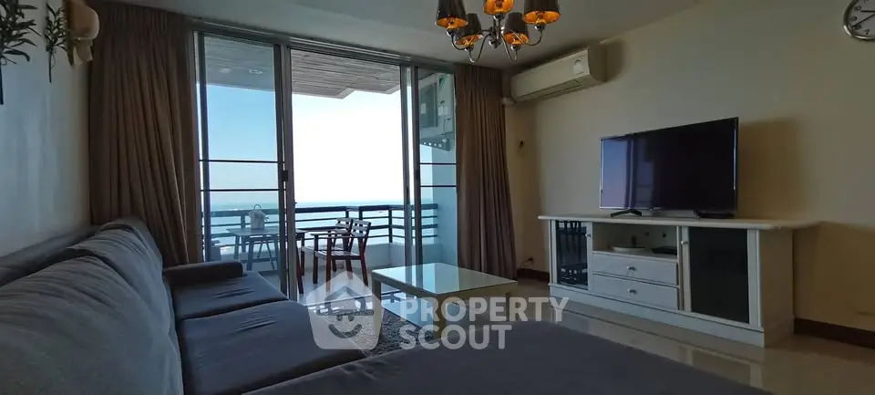 Spacious living room with ocean view balcony in modern apartment