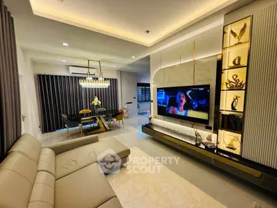 Luxurious living room with modern decor, elegant lighting, and spacious seating area.