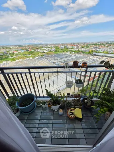 Stunning balcony view with lush plants and expansive cityscape, perfect for relaxation and enjoying the outdoors.