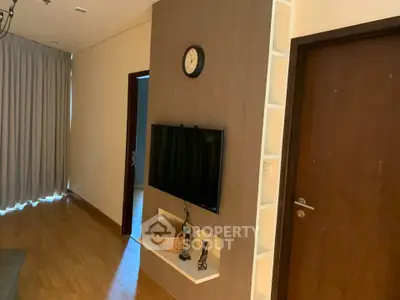 Modern living room with wall-mounted TV and stylish decor