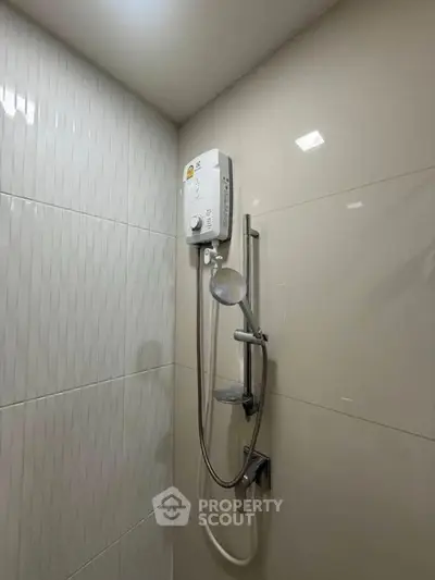 Modern bathroom with sleek shower and water heater installation