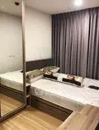 Modern bedroom with mirrored wardrobe and stylish decor