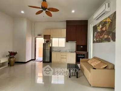 Spacious modern living room with open kitchen and stylish decor