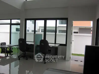 Modern office space with large windows and sleek design