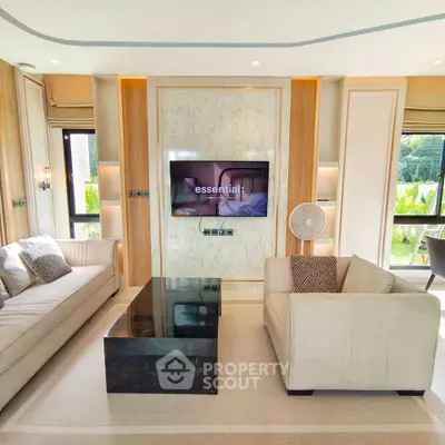 Luxurious modern living room with elegant furniture and large windows