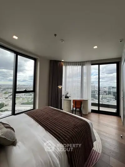 Luxurious bedroom with panoramic city views and elegant decor