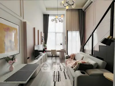 Stylish modern living room with high ceilings and elegant decor