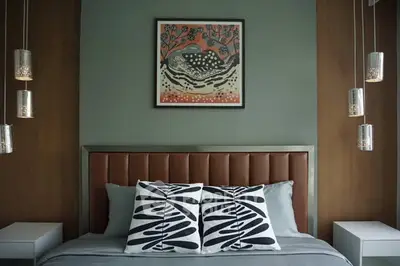 Stylish bedroom with modern decor and artistic wall art