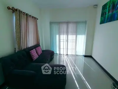 Bright living room with modern sofa and large window blinds