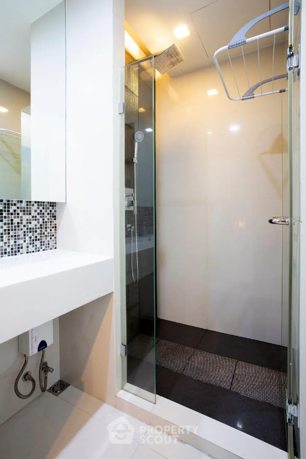 Modern bathroom with sleek shower and stylish mosaic tiles
