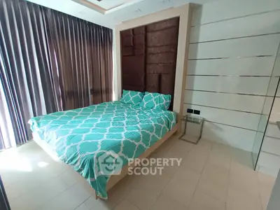 Luxurious bedroom with elegant design and modern furnishings, featuring a plush bed and stylish decor.