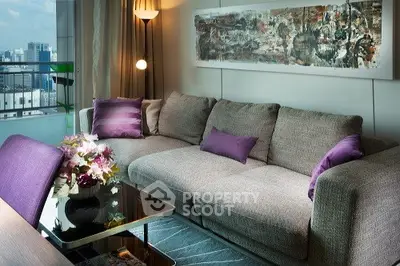 Luxurious modern living room with plush gray sofa, vibrant purple accents, and stunning city view.