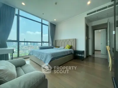 Spacious bedroom with stunning city view and modern furnishings