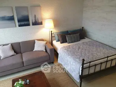 Cozy bedroom with stylish decor and comfortable seating area