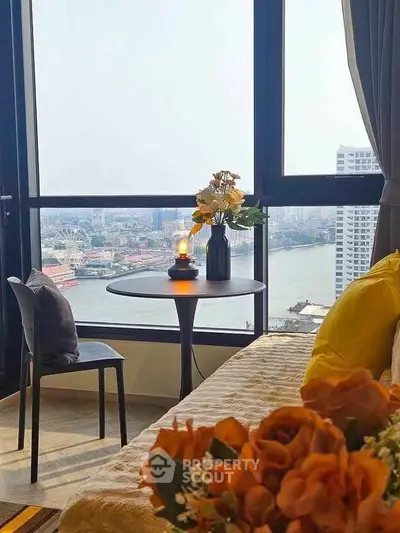 Stunning high-rise apartment with breathtaking river view and cozy interior decor.