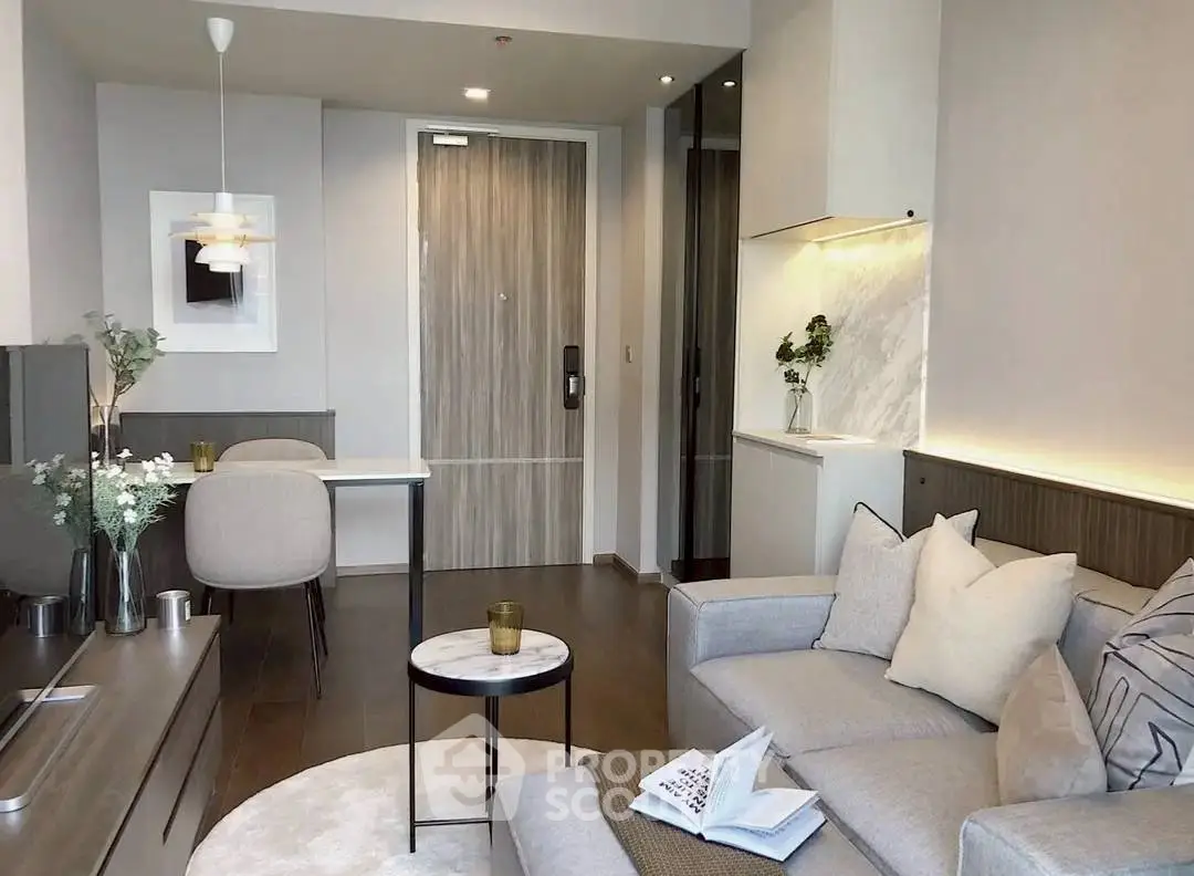 Modern living room with stylish decor and cozy seating area in a contemporary apartment.