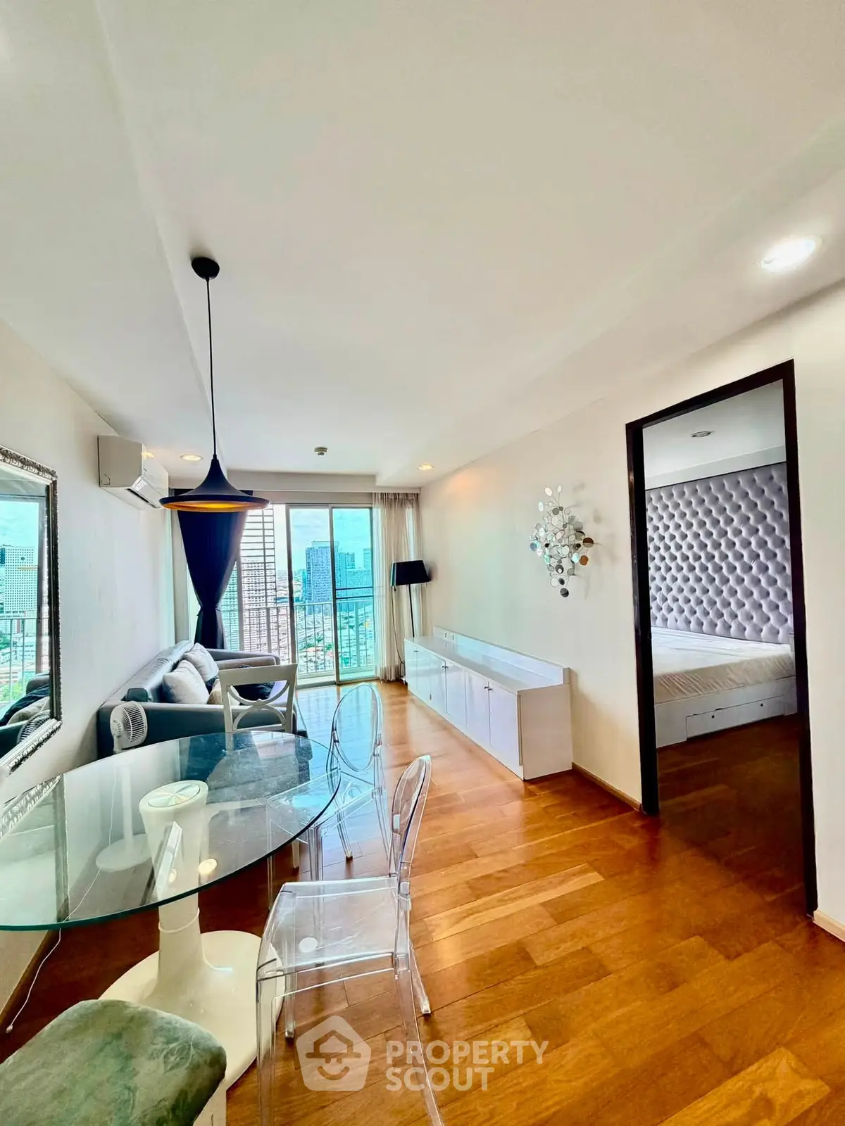 Stylish modern living room with city view, elegant decor, and open layout for a luxurious lifestyle.