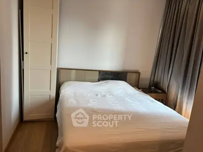 Cozy bedroom with modern decor and ample natural light