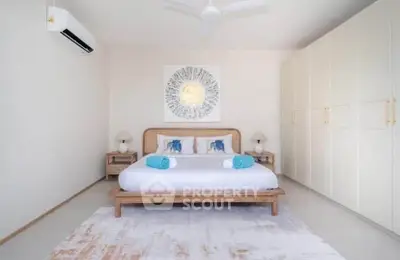 Spacious modern bedroom with elegant decor and ample storage space