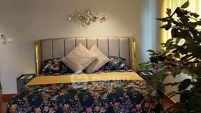 Luxurious bedroom with elegant decor and plush bedding, perfect for relaxation and comfort.