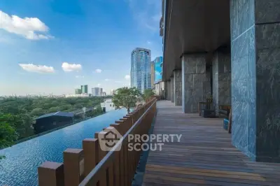 Luxurious high-rise building with stunning city view and infinity pool