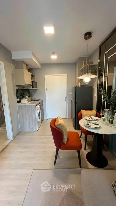 Modern compact living room with integrated kitchen and dining area