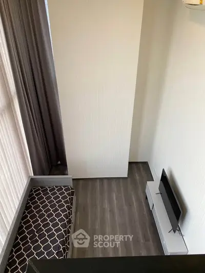 Modern compact living room with high ceiling and sleek flooring