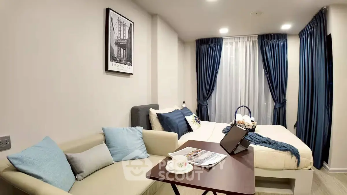 Cozy modern bedroom with stylish decor and comfortable seating area