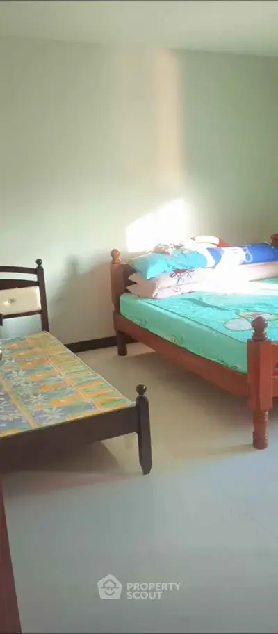 Cozy bedroom with two beds and natural light