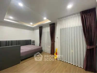 Modern bedroom with elegant curtains and cozy bed in stylish apartment