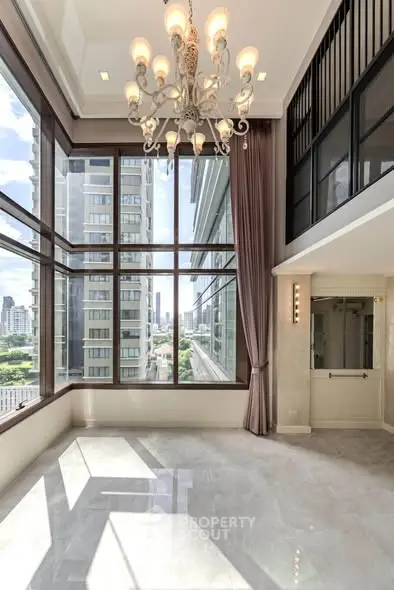 Luxurious high-rise apartment with floor-to-ceiling windows and stunning city views.