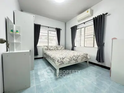 Bright and airy bedroom with modern decor and large windows