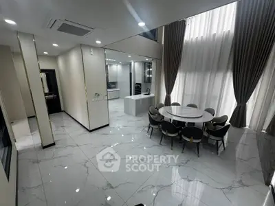 Luxurious modern dining area with high ceilings and elegant marble flooring