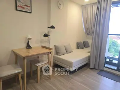 Modern living room with cozy sofa, wooden dining set, and balcony view in stylish apartment.