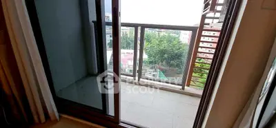 Charming balcony with city view, perfect for relaxation and enjoying the outdoors.