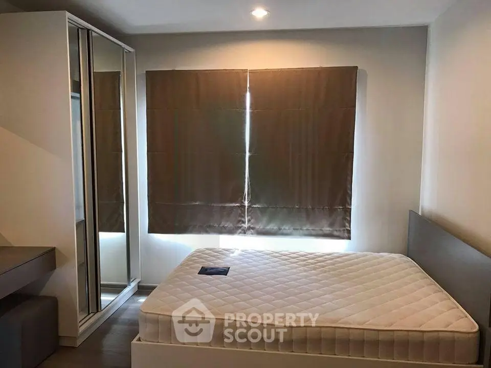 Modern bedroom with sleek design and ample natural light