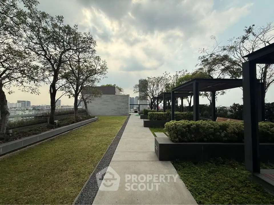 Stunning rooftop garden with lush greenery and modern pergolas offering a serene urban escape.