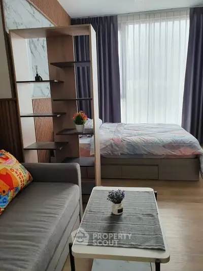 Modern studio apartment with cozy bed and stylish decor