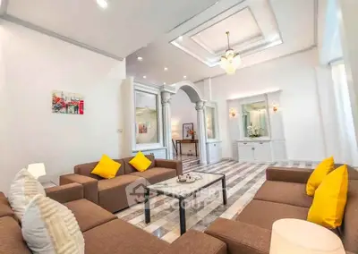 Luxurious living room with elegant decor and plush seating in a modern home.
