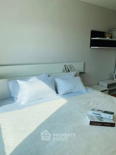 Modern bedroom with stylish decor and natural light