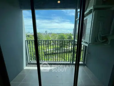 Charming balcony with scenic park view, perfect for relaxation and enjoying nature's beauty.