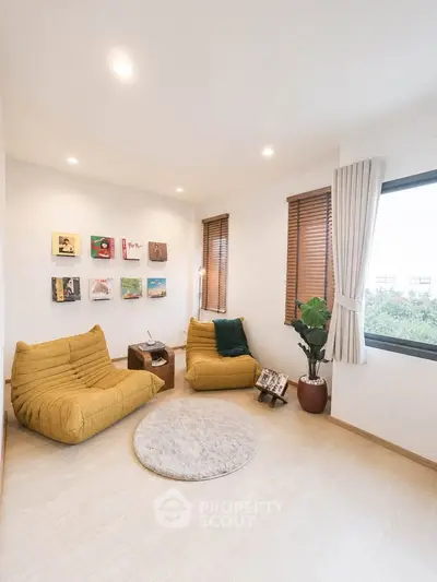 Cozy living room with modern decor and large window view