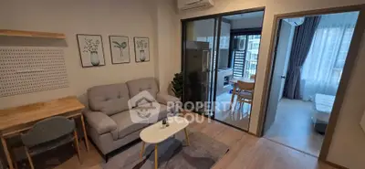 Modern living room with cozy sofa and dining area in stylish apartment