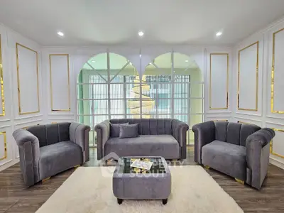Luxurious living room with elegant grey sofas and stylish decor