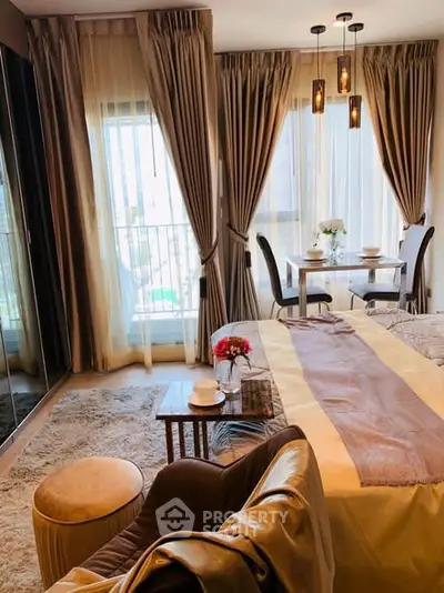 Luxurious bedroom with elegant decor and dining area, featuring floor-to-ceiling windows.