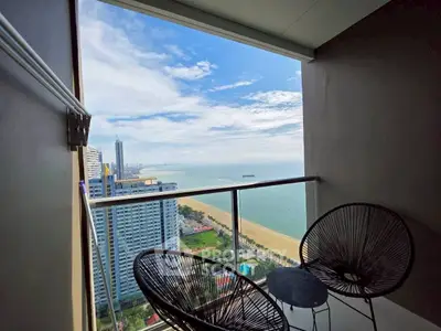 Stunning balcony view of ocean and cityscape from high-rise apartment