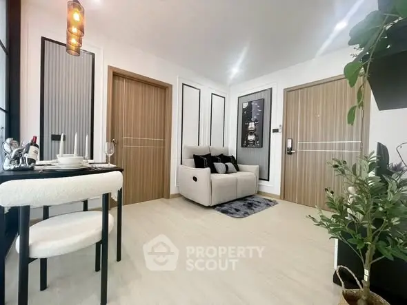 Modern living room with cozy seating and elegant dining area